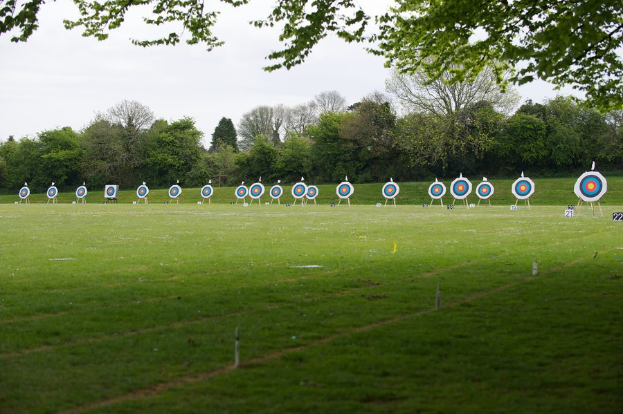 A long line of archery targets across the outdoor range